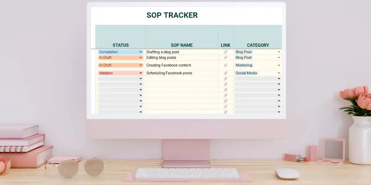 A pastel-themed desktop workspace with a monitor displaying a Google Sheets SOP tracker. The tracker includes columns for Status, SOP Name, Link, and Category, with entries like “Drafting a blog post” (Completed), “Editing blog posts” (In Draft), and “Scheduling Facebook posts” (Ideation) categorized under Blog Post, Marketing, or Social Media.